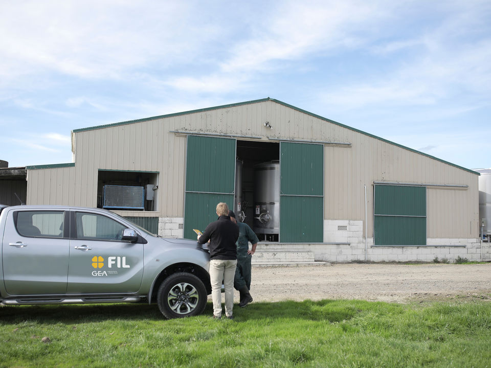 Car driving down a rural driveway