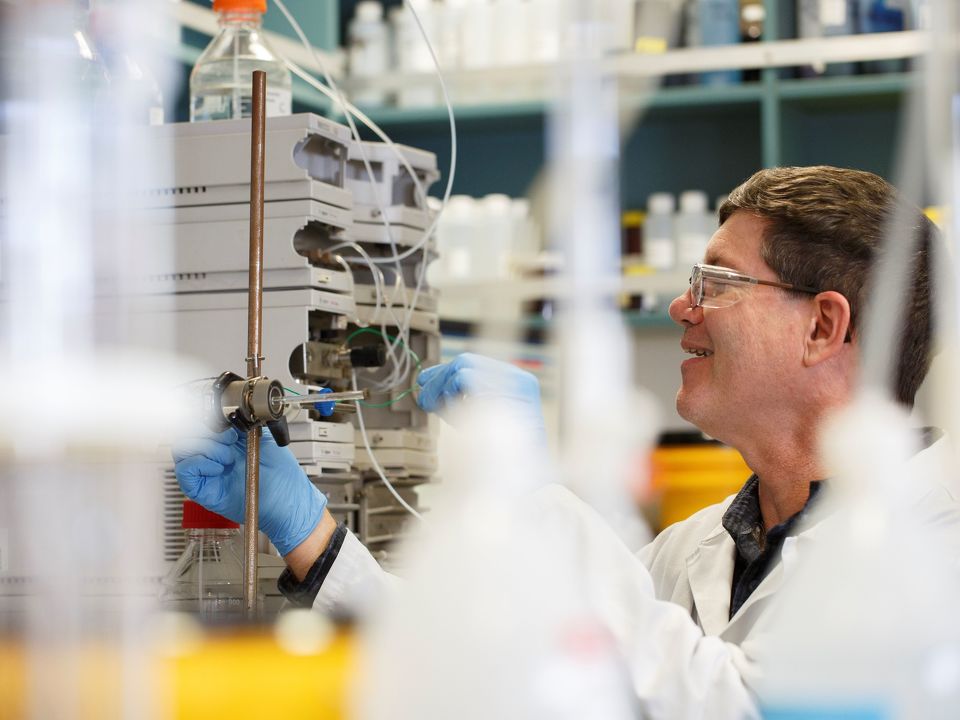 Lab technician testing chemicals